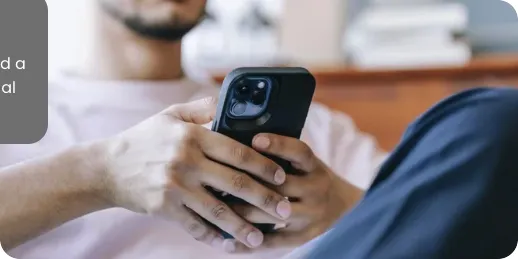 Hands holding a phone, scrolling social media